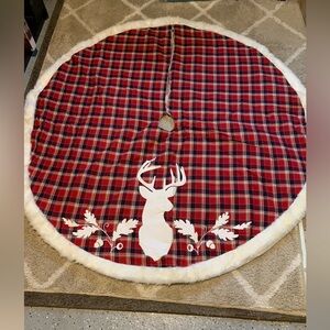 Buffalo plaid tree skirt with deer.